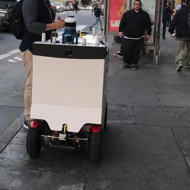 A self-driving delivery robot on the Burrito Strip in the Mission